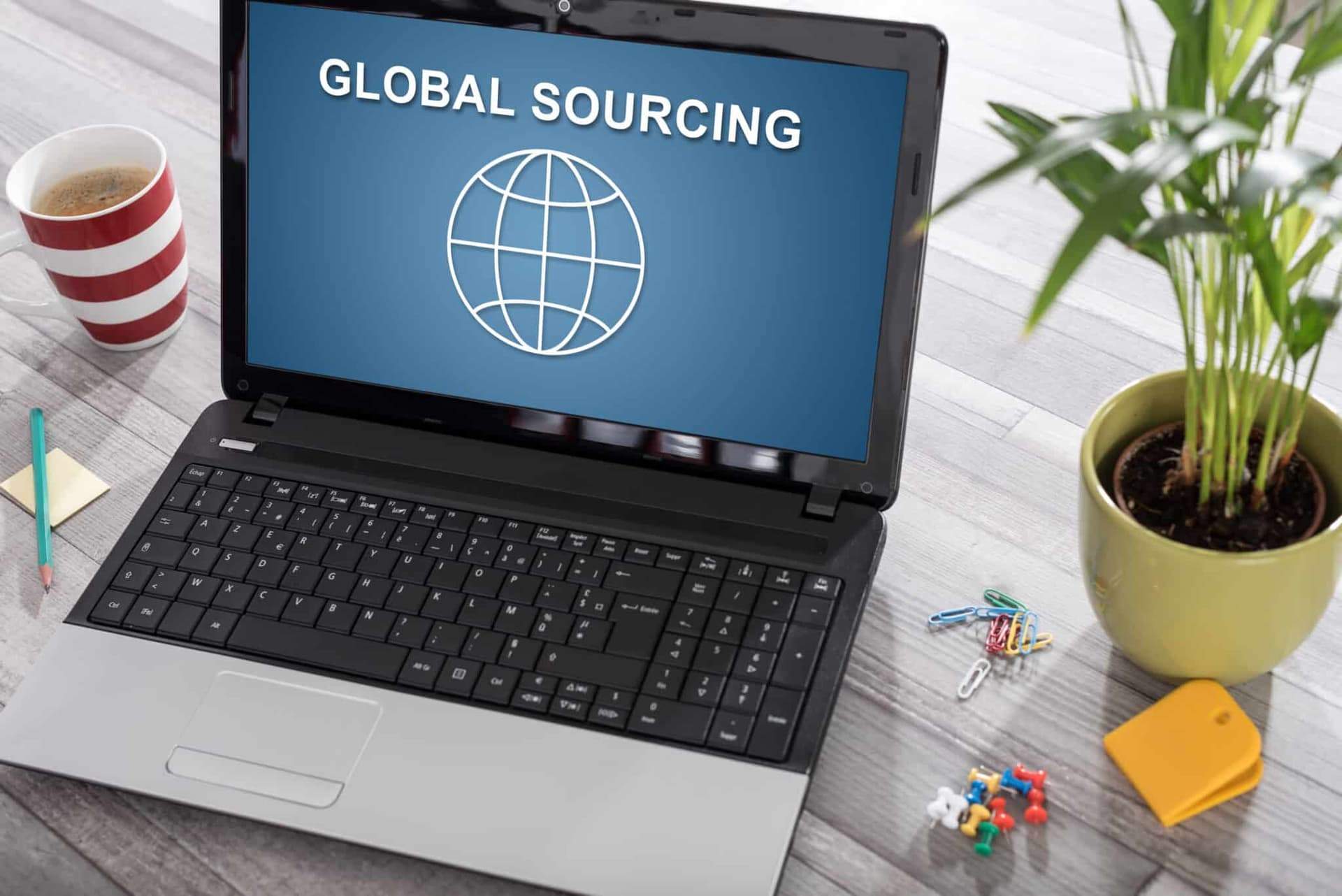 Laptop,On,A,Desk,With,Global,Sourcing,Concept,On,The