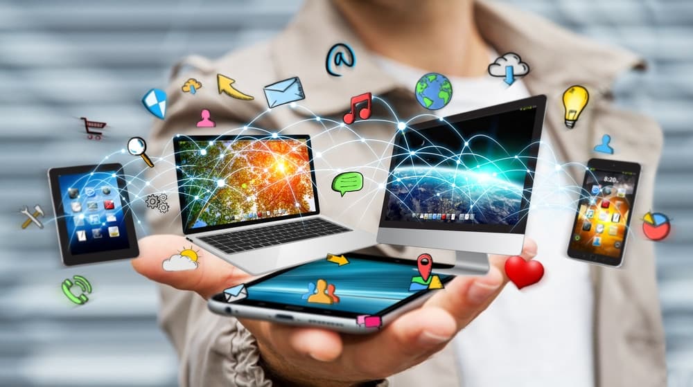 Businessman,Connected,Tech,Devices,And,Icons,Applications,With,His,Mobile